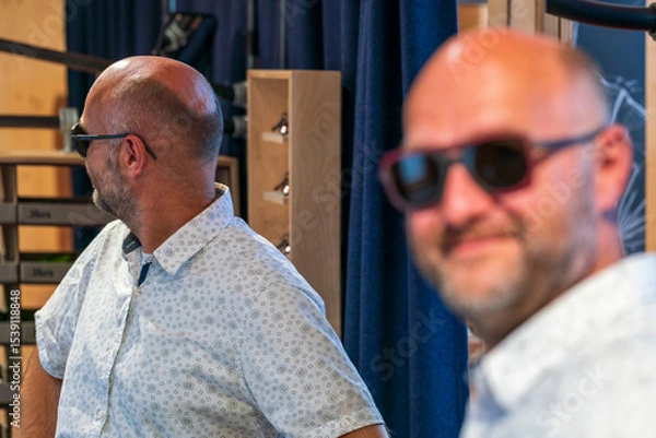 Obraz Happy man with bald head and sun glasses at shop 