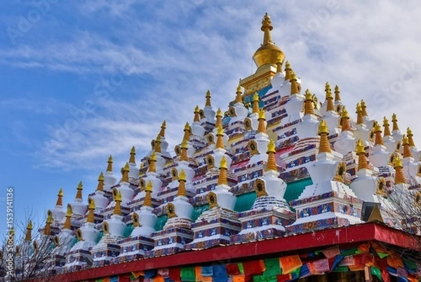 Fototapeta Colorful Tibetan stupas at Vache (Waqie) in Zoigê Marsh, showcasing traditional Buddhist architecture in the Amdo region of Greater Tibet.