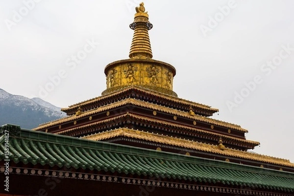 Fototapeta Golden 14-meter Great Stupa of Enlightenment at Labrang Monastery, a major Tibetan Buddhist site in Amdo, showcasing intricate architecture and spiritual heritage.