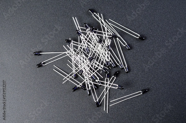 Fototapeta Macro view of black infrared photodiodes on dark surface background