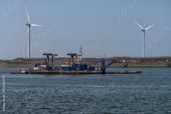 Obraz dredger is anchored in the North Sea Canal in the Netherlands