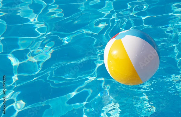 Obraz Colorful inflatable ball floating in swimming pool