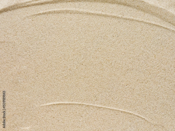 Obraz Beach sand background with natural wave pattern. Summer background of beach sand with small stones along the edges. Tourism, vacation and holidays concept. Top view.