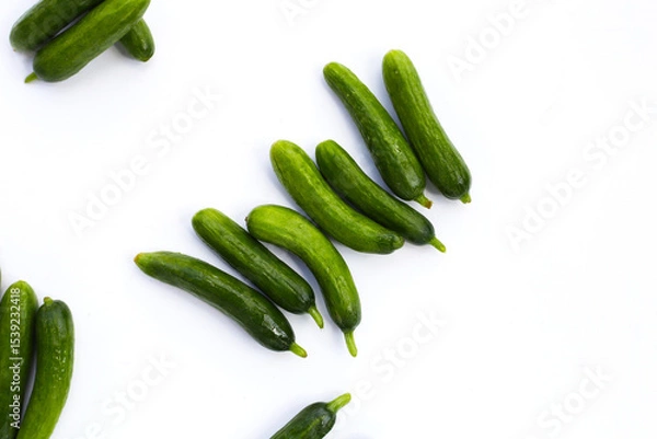 Fototapeta Mini cucumbers on white background.
