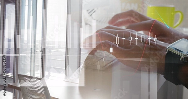 Fototapeta Typing hands at slim keyboard wearing smartwatch beside green mug in high-rise office, with charts