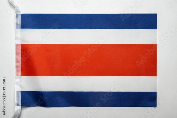 Fototapeta Closeup view of the Costa Rica national flag isolated over a white background. Concept of government and nationality