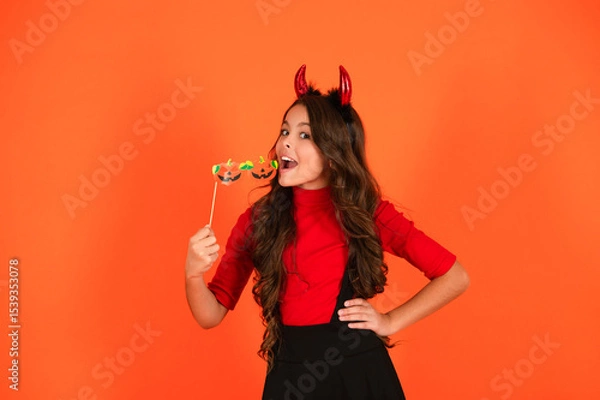 Obraz Happy Halloween. Girl devil ready for Halloween party isolated on orange. Trick or treat. All Hallows party celebration. Hallows funny props. Girl devil has Halloween party props. Red devil horns