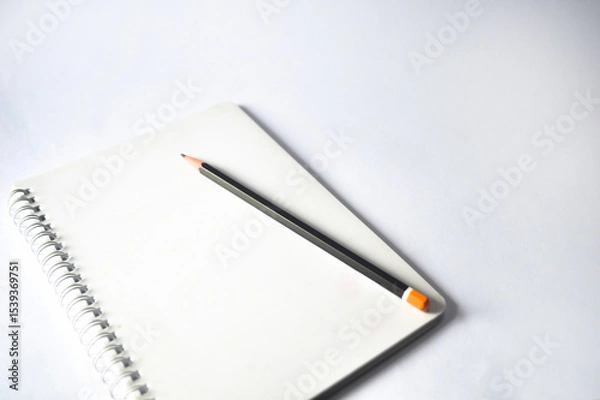 Obraz notebook and pencil isolated on white background