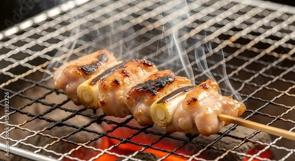 Obraz 備長炭で焼き鳥を焼いている写真
