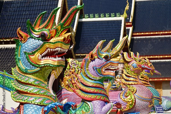 Obraz Colorful of Naga statues in Thai art decorate the steps of the ordination hall at Wat Den Sali Si Mueang Kaen temple. Located at Cheng Mai Province in Thailand.