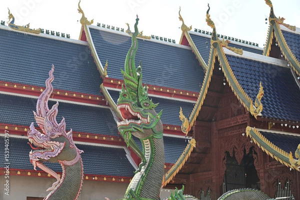 Obraz Colorful of Naga statues in Thai art decorate the steps of the ordination hall at Wat Den Sali Si Mueang Kaen temple. Located at Cheng Mai Province in Thailand.