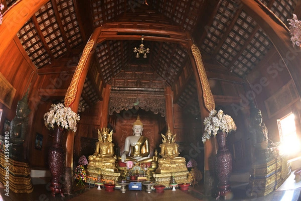 Obraz The statue of Phra Chao Tan Jai Buddha is enshrined in a teakwood chapel at Wat Den Sali Si Mueang Kaen temple or Wat Ban Den. Located at Cheng Mai Province in Thailand.