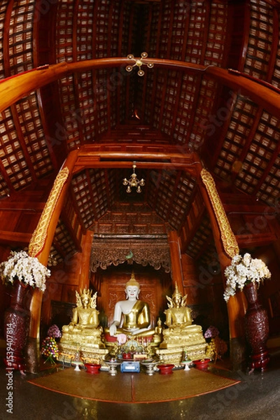 Obraz The statue of Phra Chao Tan Jai Buddha is enshrined in a teakwood chapel at Wat Den Sali Si Mueang Kaen temple or Wat Ban Den. Located at Cheng Mai Province in Thailand.
