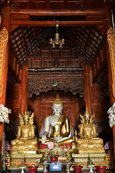 Obraz The statue of Phra Chao Tan Jai Buddha is enshrined in a teakwood chapel at Wat Den Sali Si Mueang Kaen temple or Wat Ban Den. Located at Cheng Mai Province in Thailand.