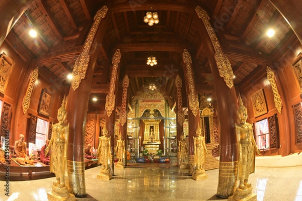 Obraz The statue of Phra Chao Pantan Buddha is enshrined in a teakwood chapel at Wat Den Sali Si Mueang Kaen temple or Wat Ban Den. Located at Cheng Mai Province in Thailand.