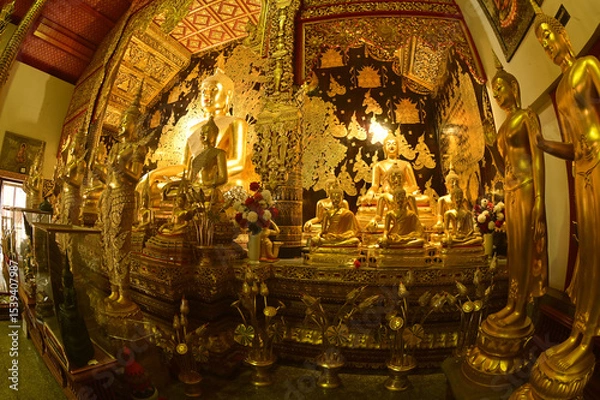 Obraz Statues of white Singha, which are animals in Thai art, decorate the front of the Church or Chapel and pagoda at Wat Den Sali Si Mueang Kaen temple. Located at Chaing Mai Province in Thailand.