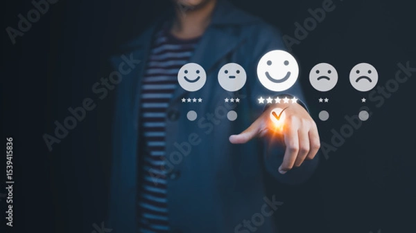 Fototapeta Person touching the virtual screen on the happy smiley face icon to give satisfaction in service. Rating very impressed, customer service, online reviews, testimonial and customer satisfaction.