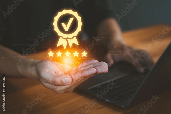 Fototapeta Person holding and showing the best quality assurance with golden five stars, representing high quality service, customer satisfaction, digital excellence, guarantee, standard, and testimonial.