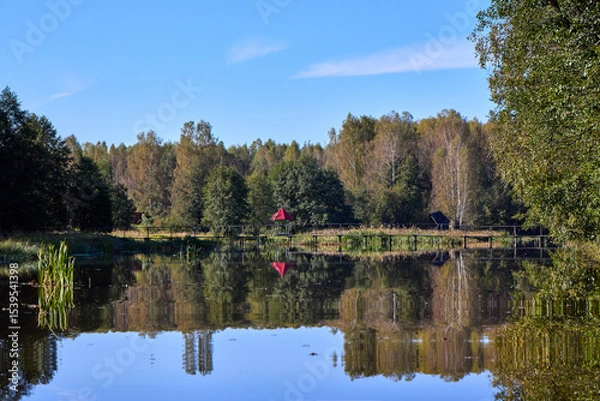 Obraz Serene Forest Lake with Wooden Bridge Reflection