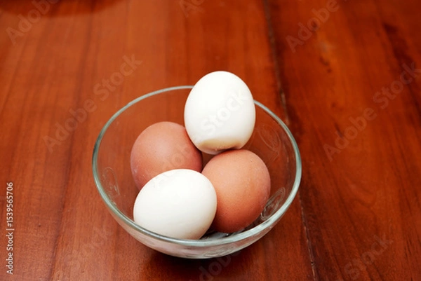 Obraz Bowl containing chicken boiled egg  on the kitchen table, prepares breakfast at home, health care and food concept. Copy space