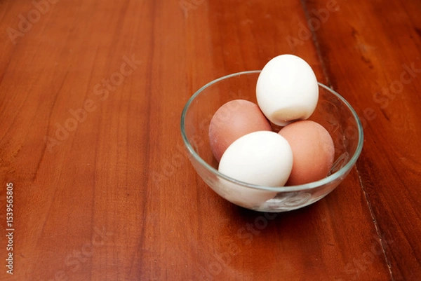 Obraz Bowl containing chicken boiled egg  on the kitchen table, prepares breakfast at home, health care and food concept. Copy space