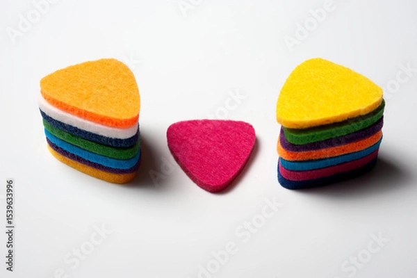 Obraz Felt picks in different colors for playing the ukulele or other string instruments.