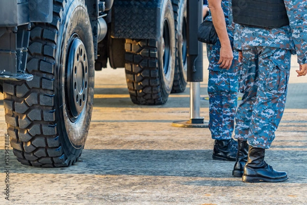 Obraz Soldiers in military uniforms wear military combat boots.