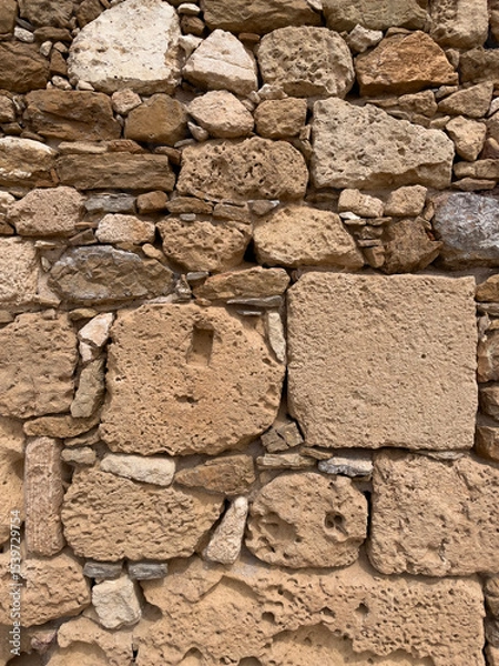 Fototapeta Rustic brown stone masonry