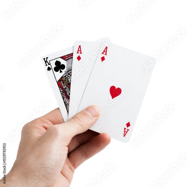Fototapeta A hand holding three playing cards, one of which is a King