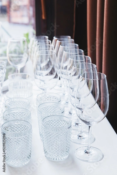 Obraz Elegant arrangement of clean glassware at an event preparation location