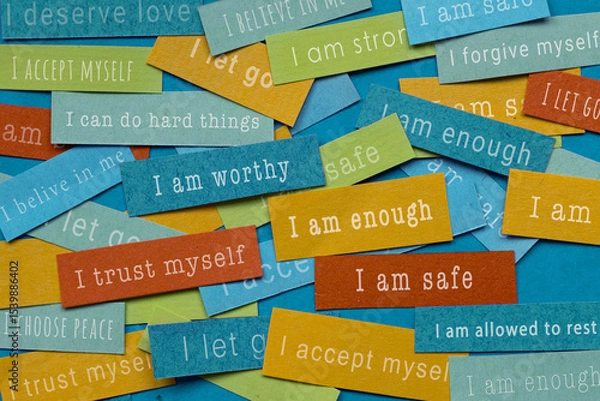 Fototapeta Affirmations or positive mindsets written on colorful papers, positive thinking, I am enough, safe, worthy
