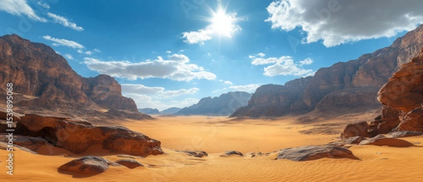 Fototapeta Desert landscape with sand dunes and rocks under the bright sun. Useful for travel articles and travel advertising.