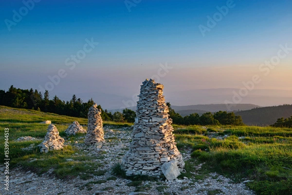 Fototapeta large mountain cairns in a beautiful landscape under blue sky in the Lure mountain in the Vaucluse in France