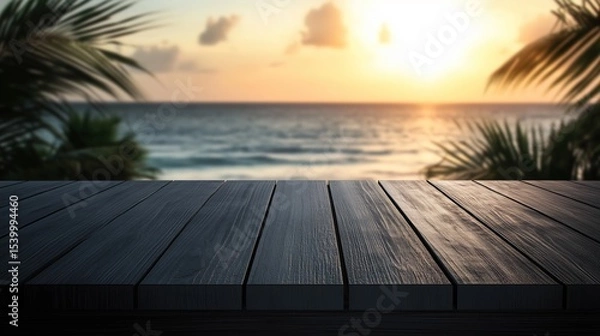 Fototapeta Empty wooden table against blurred stunning tropical sunset over a calm ocean. An ideal paradise background for summer product displays, vacation mockups, travel promotions.
