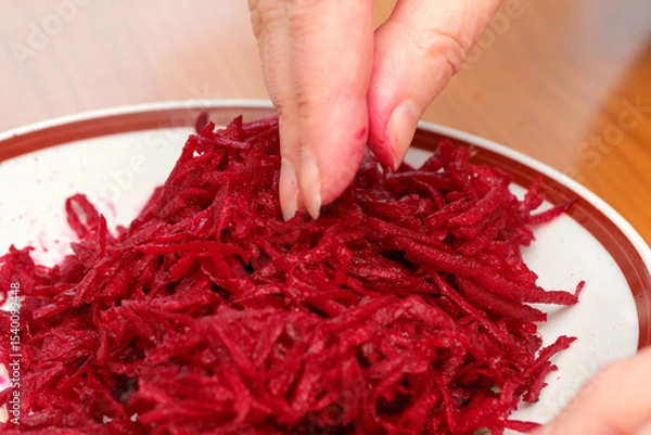 Obraz Beetroot preparation in a cozy kitchen during a sunny afternoon