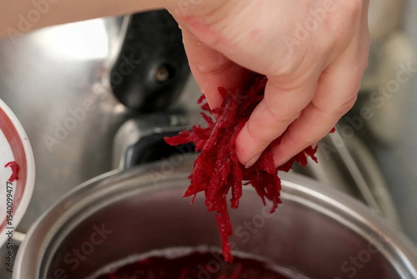 Obraz Shredding fresh beets for a vibrant culinary creation