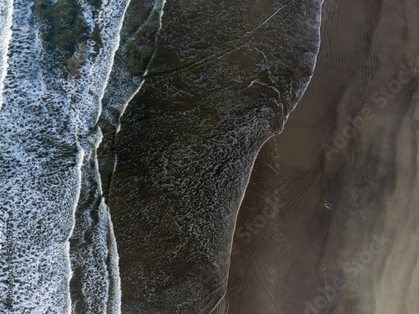 Obraz small waves on long beach seen from above