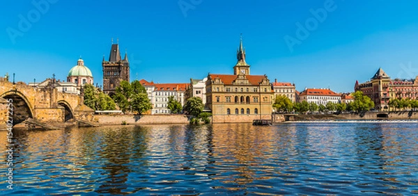 Fototapeta A view from the Vltava river looking back towards the Charles Bridge in Prague in springtime