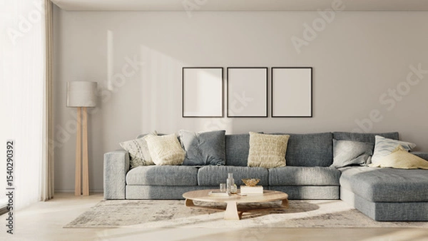 Fototapeta Three blank frames in modern living room interior with blue sofa and white wall, 3d render