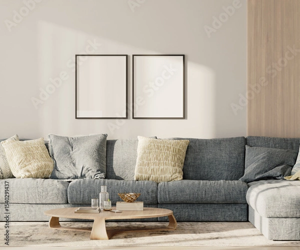 Fototapeta Two blank frames in lounge interior with blue sofa and table with wooden panel on the wall, 3d render