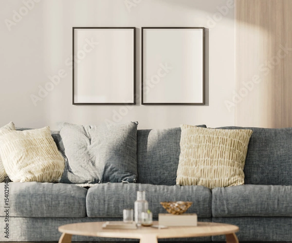 Fototapeta Two blank frames mock-up on a white wall with wooden panel above blue sofa in living room, 3d render