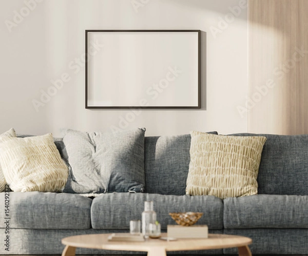 Fototapeta Horizontal blank frame mock-up on a white wall with wooden panel above blue sofa in living room, 3d render