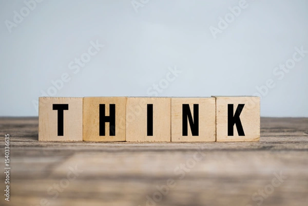 Fototapeta think word on wooden blocks on wooden table