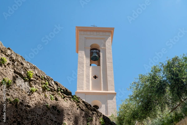 Fototapeta bell tower of the Christian Church, symbol of faith and tradition, urban element of sacred architecture, indicates a place of prayer and reflection, the tolling of the bell marks the time in the city.