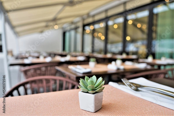 Fototapeta tranquil outdoor restaurant setting with modern canopy