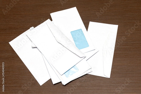 Obraz Large pile of blank open white paper envelops on a wood table