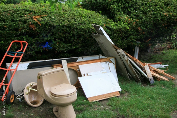 Obraz Construction Debris and Discarded Toilet in a Residential Yard