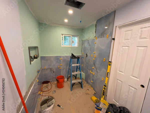 Obraz Home Bathroom Renovation Project Showing Tiled Walls and Tools in Progress