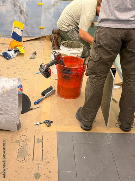 Obraz Workers Applying Finishing Touches to a Bathroom Construction Project Indoors