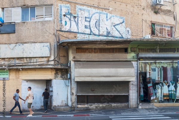 Fototapeta Petah Tikva, Israel, 12  JUNE 2025, A Detailed Architectural Drawing Of A Building With Hebrew Text On A Sign.